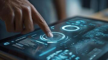 A person touching a tablet with a futuristic interface photo