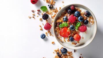 Granola with berries and yogurt on white background photo