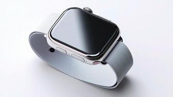An apple watch with a silver band on a white surface photo