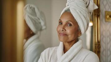 A woman in a towel looking at the camera photo