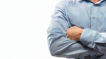 A man in a blue shirt with his arms crossed photo