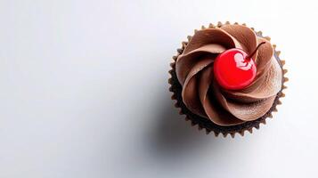 A cupcake with a cherry on top photo