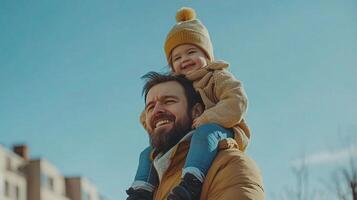 A man and a child are standing outside photo