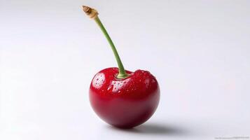 A cherry with a drop of water on it photo