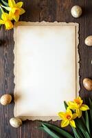 Blank vintage paper with jagged edges surrounded by yellow daffodils and speckled Easter eggs on dark rustic wood surface, spring theme Space for text photo