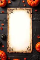 Halloween parchment with spiderweb border on black wooden table with pumpkins. Space for text photo