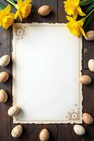 Speckled Easter eggs and yellow daffodils frame a blank floral sheet on a rustic wooden table, perfect for spring or Easter-themed designs photo