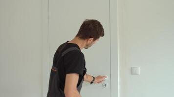 Worker checking vertical alignment of door with bubble level video