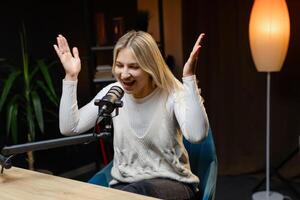 Radio host speaking with energy during a live podcast recording photo