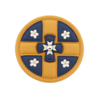 A round leather accessory with yellow and blue design features central cross and floral motifs, creating stylish and unique appearance. craftsmanship is detailed and elegant png