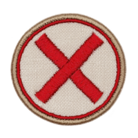 A round embroidered patch features bold red X in center, outlined with red circle and bordered by tan edge, set against beige fabric background png