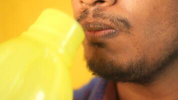 Refreshing drink enjoyed after exercise in bright setting video