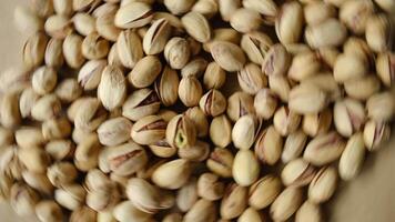 Pile of pistachios nuts rotating. Healthy food background. video