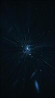 Dark stylish futuristic space background - flying at hyperspace warp speed through glowing star light beams, waves and particles. Galaxy starburst explosion vertical animation. video