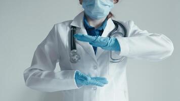 A healthcare professional in a lab coat demonstrates proper handwashing and sanitization techniques, emphasizing the importance of safety and hygiene in protecting staff and patients video
