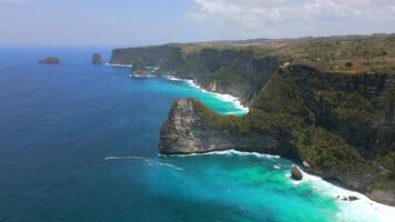 Aerial view of scenic cliffs and turquoise water on Nusa Penida Island, Bali, Indonesia. Stunning landscape ideal for travel, nature, and tropical paradise themes video