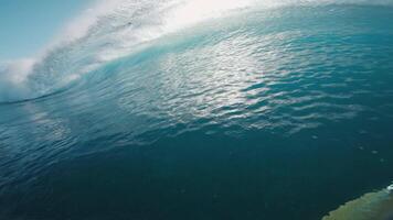 Surfer first person view rowing on surfboard in ocean with breaking waves. video