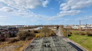 Industrial district overview in Germany with mix of urban housing, roads, and warehouse structures below photo