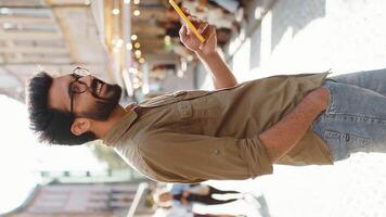 Tourist traveler young man guy using looking smartphone search a way on map in mobile navigator app video