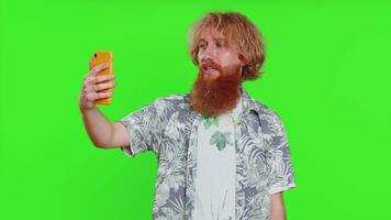 Happy man blogger taking portrait selfie record call online with social media subscribers video