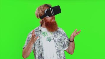 Excited man in VR headset helmet watching virtual reality 3D , playing simulation online game video