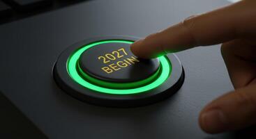 Finger presses a green glowing button labeled '2027 BEGIN', symbolizing the start of the year 2027. Represents new beginnings, future plans, and technological advancements. photo