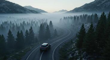 Car drives on winding road through a foggy forest in the mountains. Landscape with coniferous trees and mist. Adventure and travel concept. photo