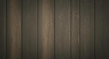 Close up of a wall made of vertical sun bleached wooden planks. The wood has a worn texture with grain patterns and soft greyish brown tones. photo