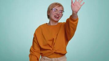 Woman showing inviting gesture with hands, ask to join, beckoning to coming, gesturing hello goodbye video
