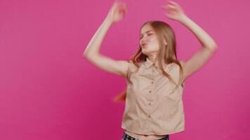 Cheerful woman having fun dancing, moving to rhythm, dabbing raising hands, making dub dance gesture video