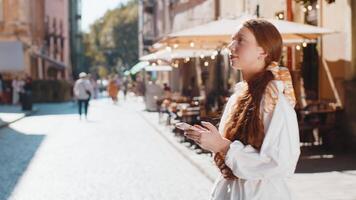 Tourist traveler girl child using looking smartphone search a way on map in mobile navigator app video