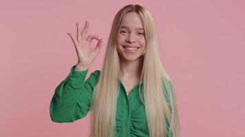 Happy girl looking approvingly showing ok approve feedback gesture like sign positive something good video