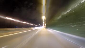 Time-lapse of car journey on night road using long exposure video