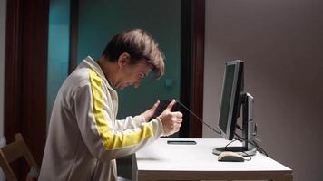 Man frustrated working from home having problems with computer video