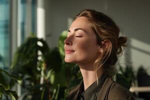 A woman with closed eyes enjoys sunlight streaming through a window, surrounded by lush green plants, creating a serene and peaceful atmosphere within an indoor garden space photo