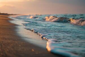 Waves gently crashing on a sandy beach during a sunset, with an orange-pink sky reflecting on the water. The serene seascape evokes calmness and tranquility, with hints of distant clouds photo