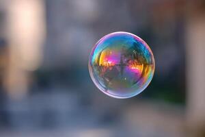 Translucent soap bubble reflects vivid colors and blurred cityscape, creating an ethereal effect. The image is a captivating example of light, color, and fragility in harmony photo