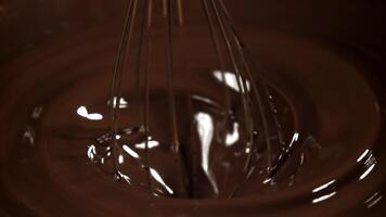 Chocolate is stirred with a whisk. Filmed on a high-speed camera at 1000 fps. High quality FullHD footage video