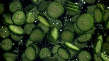 Sliced cucumbers fly up and fall down. Filmed on a high-speed camera at 1000 fps. High quality FullHD footage video