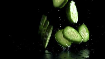 Sliced cucumbers fall on the table. Filmed on a high-speed camera at 1000 fps. High quality FullHD footage video