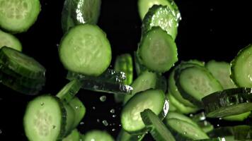 Sliced cucumbers fly up and fall down. Filmed on a high-speed camera at 1000 fps. High quality FullHD footage video