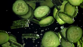 Sliced cucumbers fly up and fall down. Filmed on a high-speed camera at 1000 fps. High quality FullHD footage video