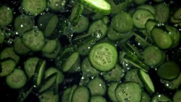 Sliced cucumbers fly up and fall down. Filmed on a high-speed camera at 1000 fps. High quality FullHD footage video