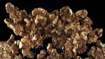 Walnuts fly up and fall down. Filmed on a high-speed camera at 1000 fps. High quality FullHD footage video