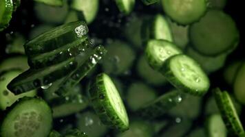 Sliced cucumbers fly up and fall down. Filmed on a high-speed camera at 1000 fps. High quality FullHD footage video