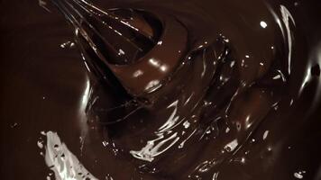 Chocolate is stirred with a whisk. Filmed on a high-speed camera at 1000 fps. High quality FullHD footage video