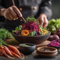 Chef preparing a salad with vegetables and herbs photo