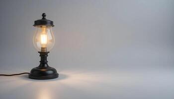 An old fashioned lamp with a light bulb on a table photo