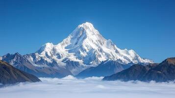 A mountain is seen in the clouds with a blue sky photo