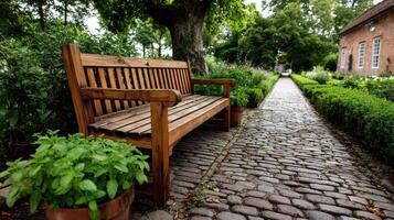 A wooden bench sitting on a brick path photo